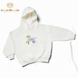 Light blue , light skin hooded sweatshirt with a cartoon horse design.