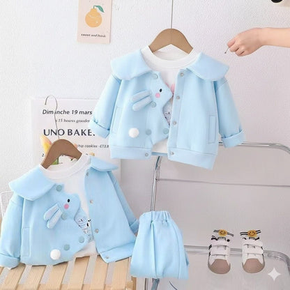 A light blue jacket with a collar and bunny design on the front